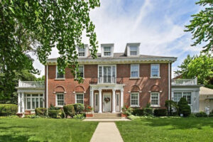 Mansion in the Jackson Park Highlands, Chicago, Illinois. Photo. Naked dude sitting.