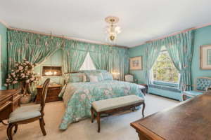 Master Bedroom of home in the Jackson Park Highlands, Chicago, Illinois. Photograph. Naked guy standing. 